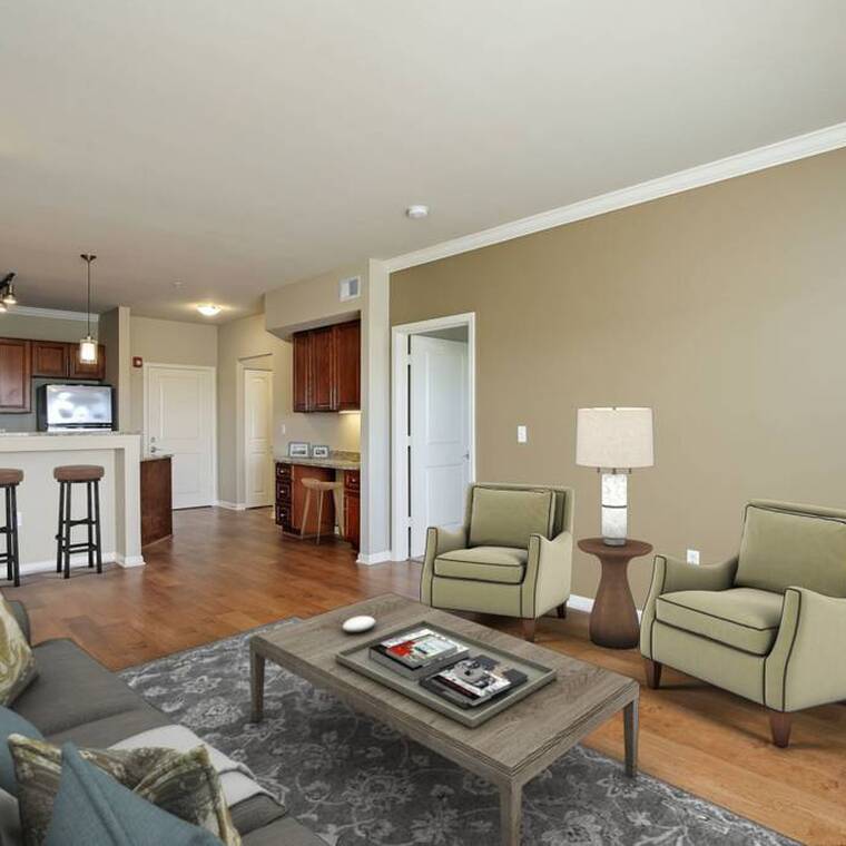 Open concept with hardwood flooring, granite and stainless steel appliances.